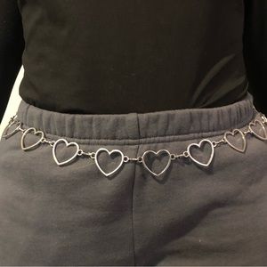 Silver heart shaped belt with clasp, fits up to a size XL.